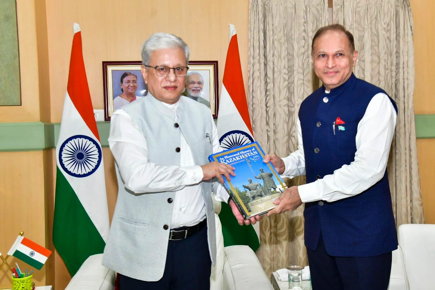 Dr. Nawab Mir Nasir Ali Khan presents a book on Kazakhstan to Telangana Governor Jishnu Dev Varma at Raj Bhavan, Hyderabad, in September 2024.